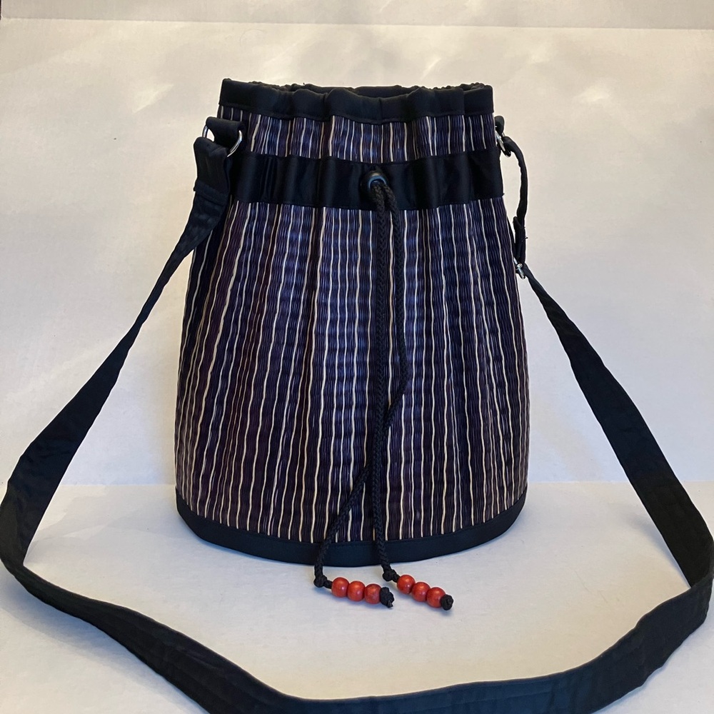 Black and natural straw shoulder bag